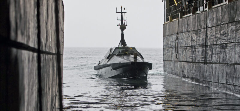 Image of the MAST-13 Autonomous Surface Vehicle, entering the loading dock of HMS Albion.

HMS Albion hosted Exercise Autonomous Advance Force in March 2020 to show case the abilities of the unmanned projects. 

47 Commando worked alongside HMS Albion and NavyX to trial unmanned technology in Norway. Exercise Autonomous Advanced Force looked at how the Royal Navy and Royal Marines could benefit from the latest technology and enhance future operations.

It put unmanned boat Mast 13, drone Malloy and remote-piloted aerial system Puma through their paces in harsh Arctic conditions and in an operational theatre alongside Albion.

It is the latest in a series of trials as part of the Royal Navys commitment to technology and innovation and the Future Commando Force concept.